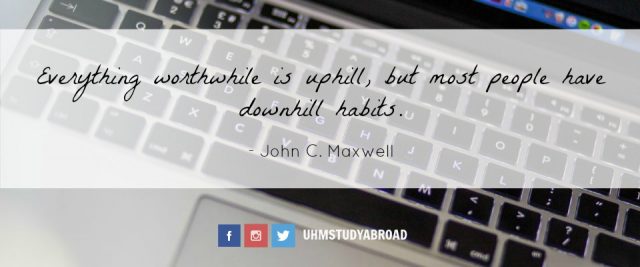 Image of a computer keyboard with a quote by John C. Maxwell: Everything worthwhile is uphill, but most people have downhill habits.